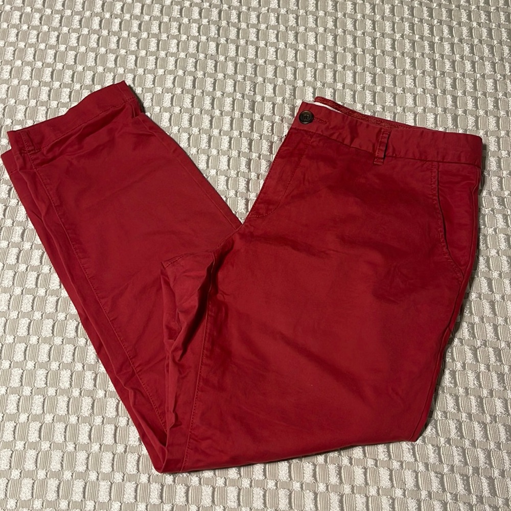 Label of graded goods, red chino pants size 14